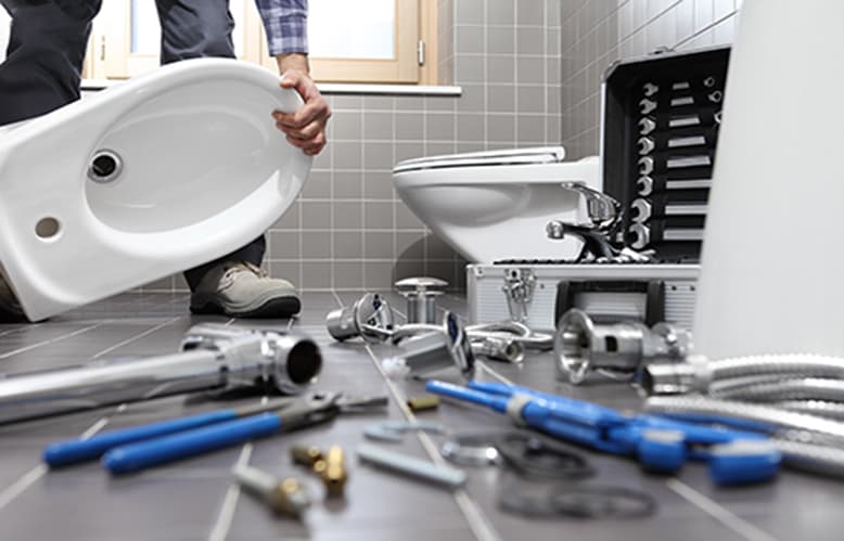 A repaired toilet in a residential bathroom.